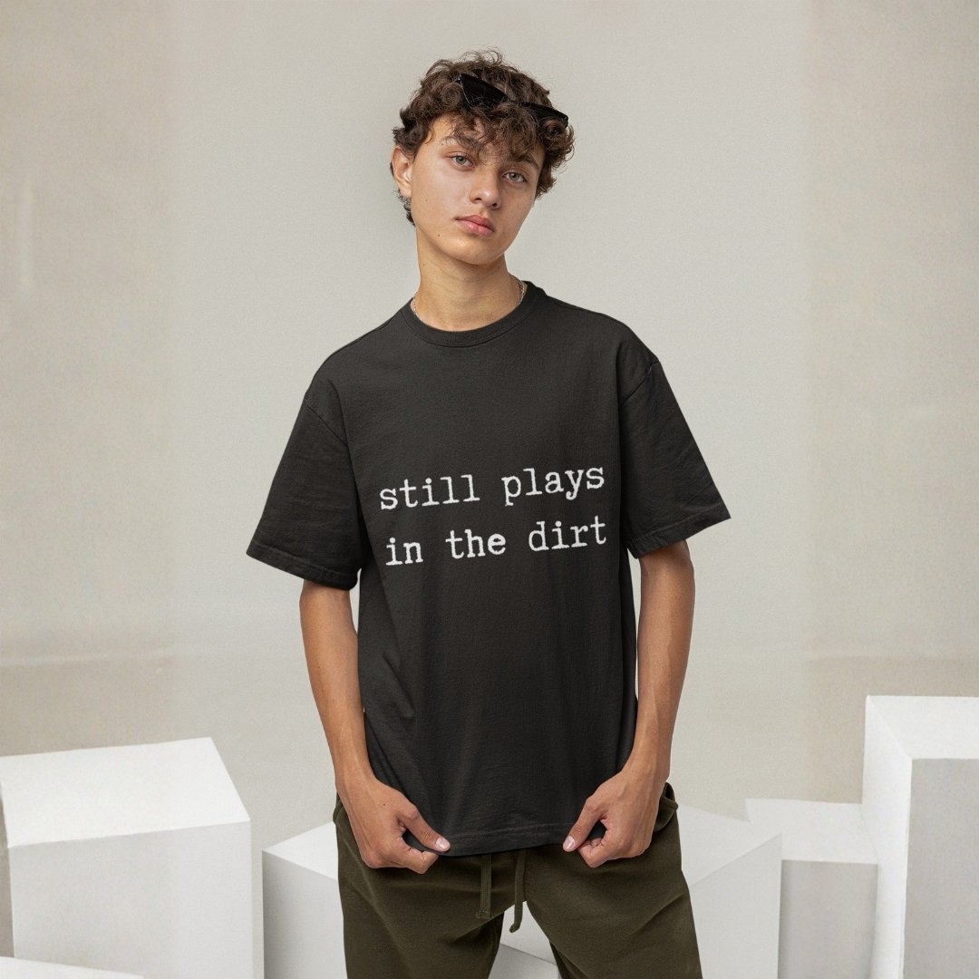 "Unisex" Still Plays In The Dirt - Funny, Drop Shoulder Tee